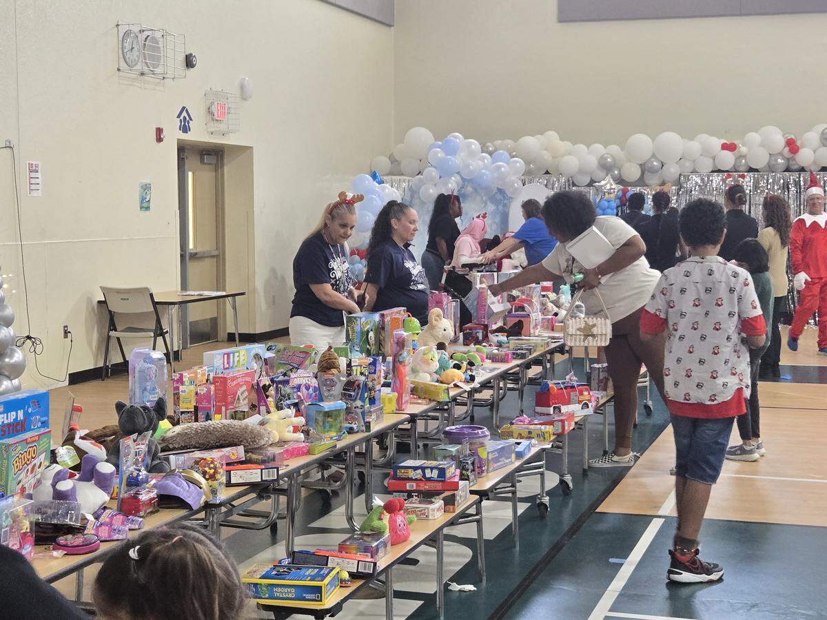 Kids browsed the table of hundreds of gifts to close out the Winter Wonderland event for ESE elementary students at Glades Middle School.
