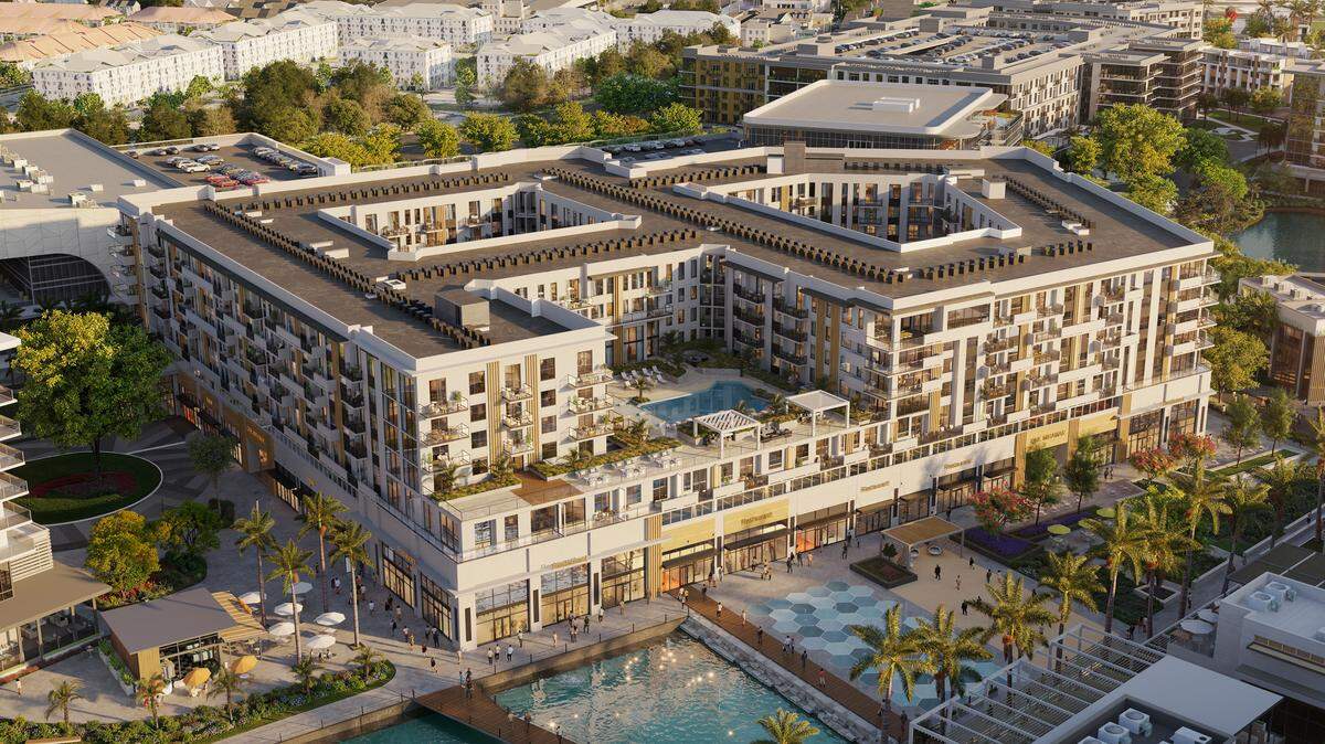 Apartments and retail buffer a 5.5-acre water basin with a fountain feature in Miramar Cove’s design.